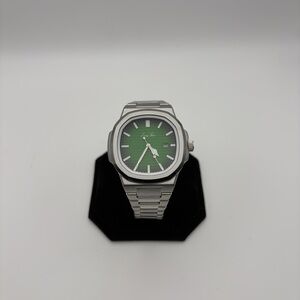 Lucky Fours watch green dial stainless steel , new battery